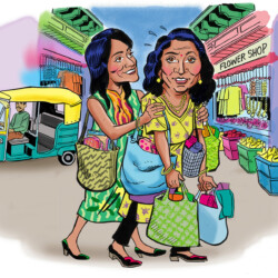 Two women carrying shopping bags walk through a market street with an auto rickshaw and flower shop in the background.