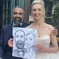 A bride and groom sit together, holding a caricature portrait of themselves labeled "Wedding Day" and "August 5, 2023.