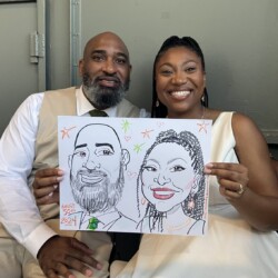 A smiling couple sitting together holds a caricature portrait of themselves dated August 30th, 2024.