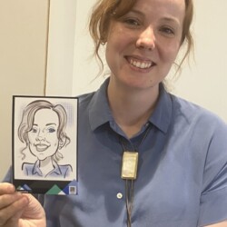 A woman holding up a picture of a woman.